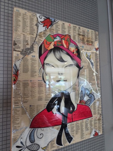 A mixed-media portrait of a woman in a red scarf and headwrap, painted over newspaper TV listings with silver leaf
