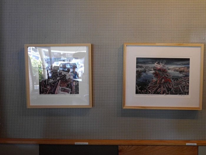 Two framed paintings side by side on the gallery wall