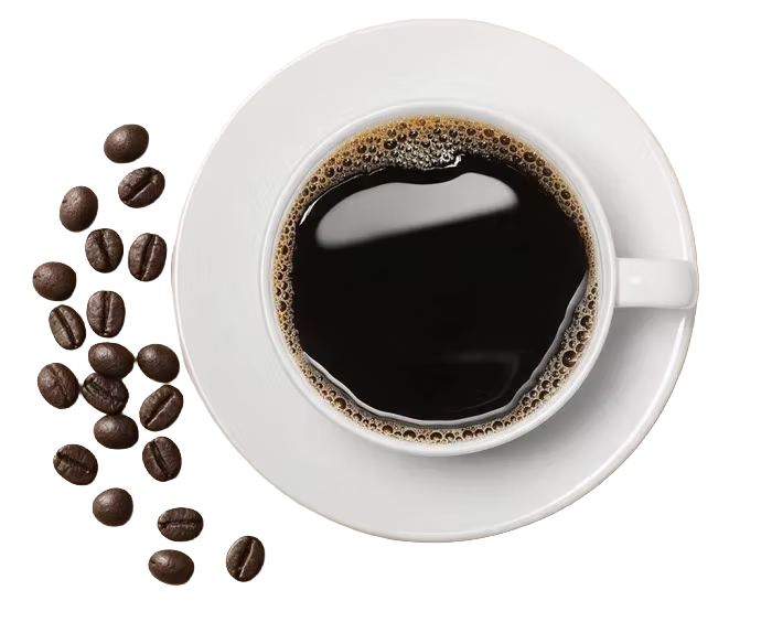 A cup of black coffee on a white saucer, seen from above, next to a scatter of coffee beans