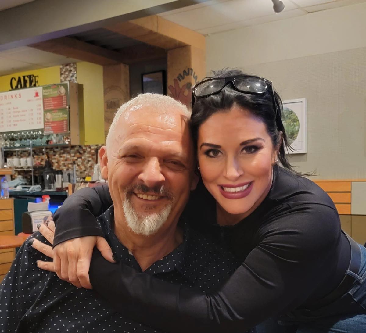Slava, the owner, sharing a hug with Jenn, a former resident DJ at the coffee shop